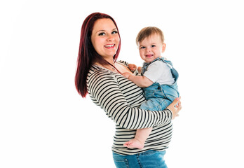 Cheerful baby boy toddler with his mother on white studio background