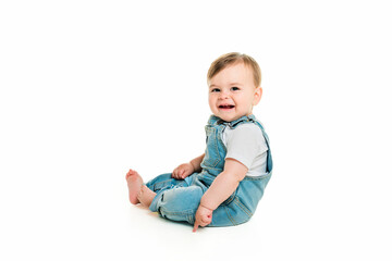Cheerful baby boy toddler on white studio background