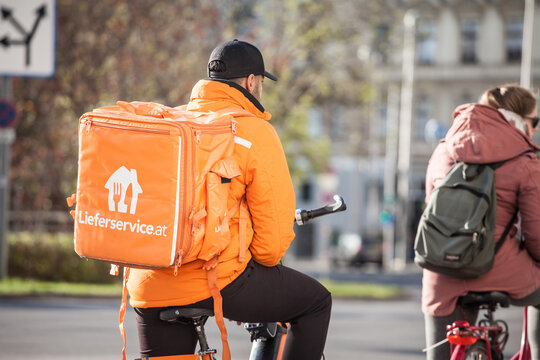 VIENNA, AUSTRIA - NOVEMBER 6, 2019: Lieferservice logo on a delivery guy in Vienna. Also called Lieferando, it is a subsidiary of Takeaway.com, a Dutch delivery service company