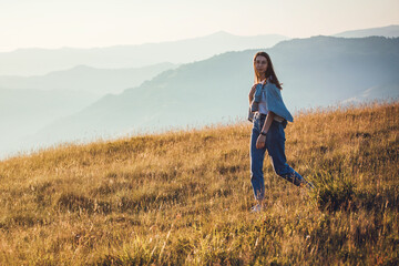 Pretty Teen Girl Walking in Mountain Sunrise Landscape