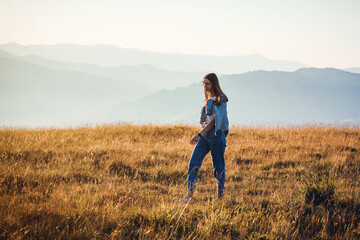 Naklejka na ściany i meble Pretty Teen Girl Walking in Mountain Sunrise Landscape