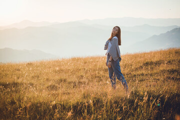 Happy Teen Girl in Golden Mountain Sunrise Landscape 