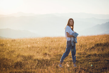 Happy Teen Girl in Golden Mountain Sunrise Landscape 