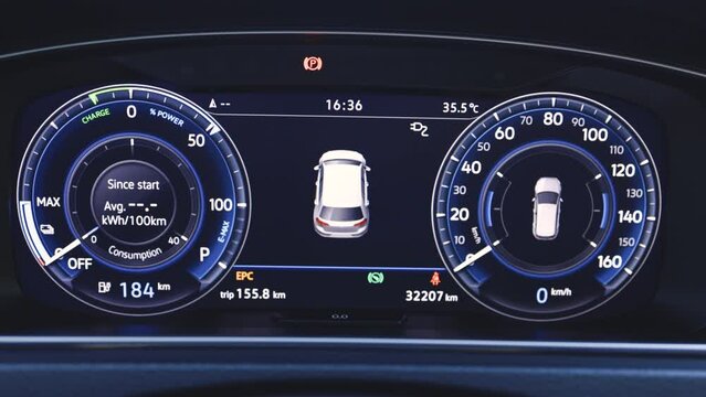 Close up shot electric car dashboard view during fast charging when parked at power charging station. Green energy zero emission car. Long range electric vehicle. Future of cars