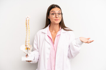pretty woman feeling puzzled and confused and doubting. spine specialist concept