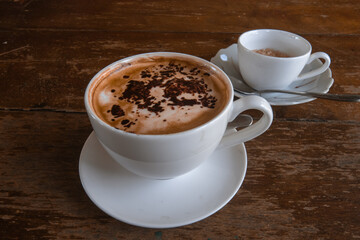 A cup of coffee topped with cinnamon