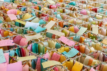 Rows of colorful papers with written dreams and wishes in Taiwan