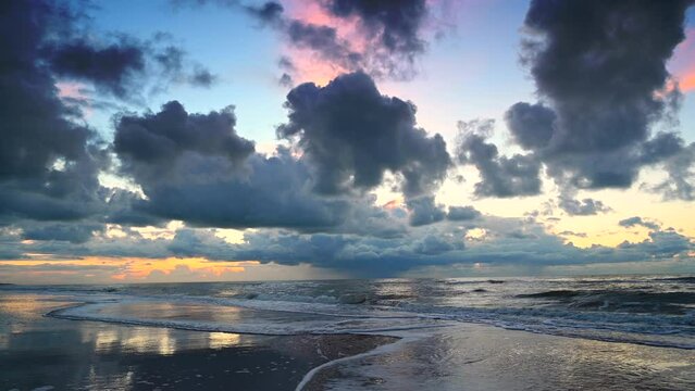 Sunset at the North Sea beach after a stormy autumn day at Texel island in the Dutch Waddensea region in The Netherlands.
