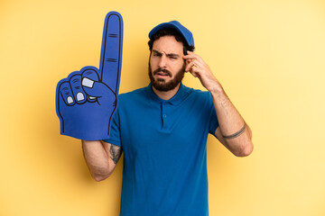 young man feeling confused and puzzled, showing you are insane. one hand fan concept