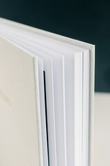 Close-up shot of a photo album or wedding album with white minimalistic cover
