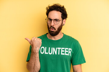 young man looking astonished in disbelief. volunteer concept