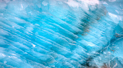 A close-up of the layered surface of a blue glacier - Knud Rasmussen Glacier near Kulusuk - Greenland, East Greenland - obrazy, fototapety, plakaty