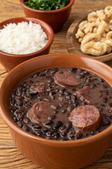 Typical brazilian feijoada with kale, rice and cracklings