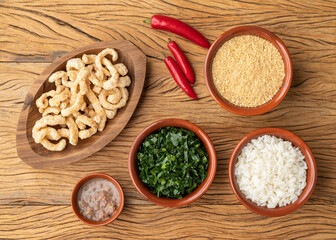 Kale, rice, farofa, cracklings and pepper, typical brazilian feijoada sidedishes