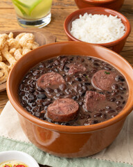 Typical brazilian feijoada with rice, caipirinha, farofa and cracklings
