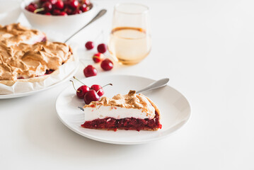Plate with tasty cherry pie on white background. Front view. Copy space