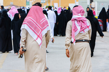 Riyadh, Saudi Arabia - February 23, 2018 in Riyadh, Saudi Arabia Back of Saudi Men wearing traditional clothes in festivial 