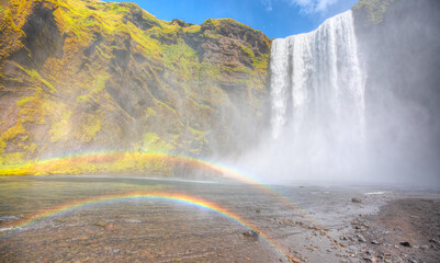 View of famous Skogafoss waterfall with double rainbow  - Iceland