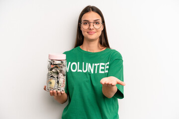 pretty woman smiling happily with friendly and  offering and showing a concept. volunteer and...