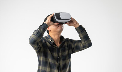 Asian handsome man with using virtual reality headset or VR glass isolate on gray background