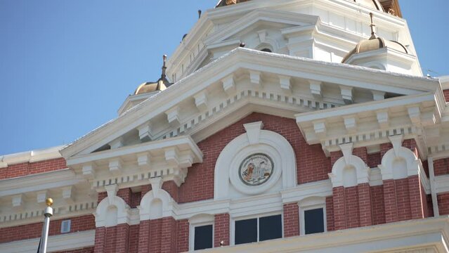 Closeup tilt up of Berkeley County courthouse pediment in Martinsburg, West Virginia, WV