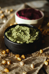 Beetroot hummus and spinach hummus. Vegan recipes, plant-based dishes. Homemade healthy organic food. Vegetarian cuisine. Top view 