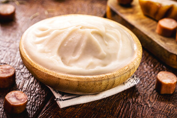 wooden bowl with lard, pork fat used as a cooking ingredient in brazil