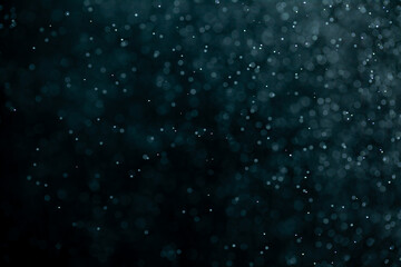 Glowing blue highlights. Wallpaper pattern. Blue sparkling spots. Dust or fog on a black background.