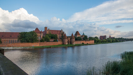 Naklejka na ściany i meble Beautiful teutonic castle at Malbork. View from the bridge. Poland