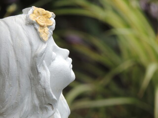 statue of  white angel on the garden decoration