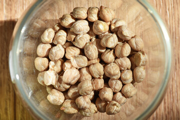 Dry raw chickpea. Ingredient for making soup or garnish. Above view. Culinary background texture.