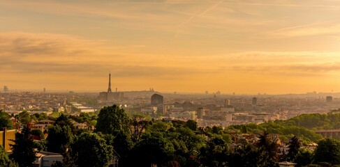 Beautiful view of the Paris under the sunset lights in France