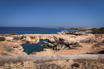 Kamara Tou Koraka Stone Arch Monarchus Arch, called a Love Bridge. Cyprus, Cape Greco. 
