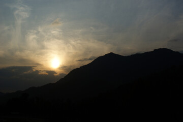 The sunset and the silhouette of the mountain