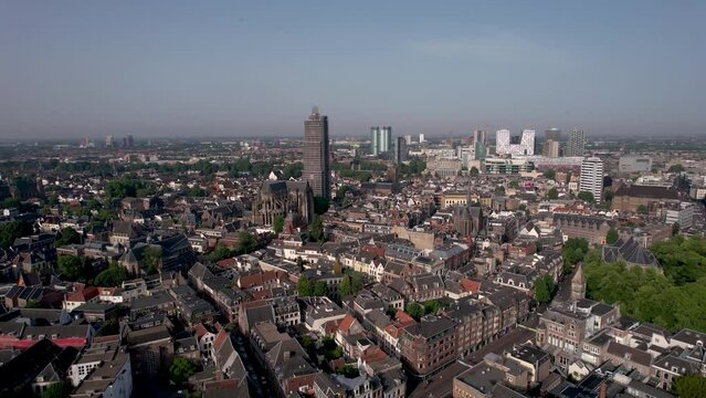 Medieval Dutch city centre aerial with church cathedral in scaffolding towering over the city lit up by early morning sunlight. Cityscape urban area