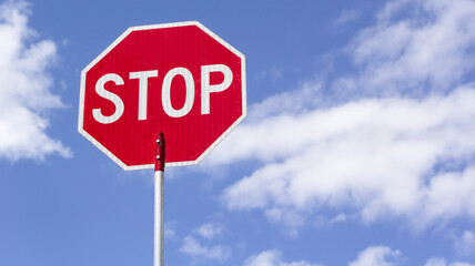 Stop sign and blue sky with copy space