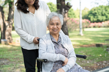 Caregiver help and care Asian senior or elderly old lady woman patient sitting and happy on...