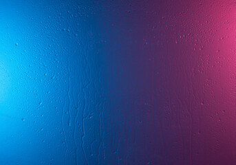 Background of natural water condensation,Water and rain drops on the glass, abstract view, Drops of rain on blue and red glass background