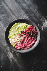 Beetroot hummus and spinach hummus. Vegan recipes, plant-based dishes. Homemade healthy organic food. Vegetarian cuisine. Top view 