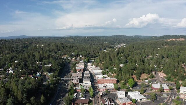 Aerial wide panning shot of the historical mountain town Placerville in Northern California. 4K