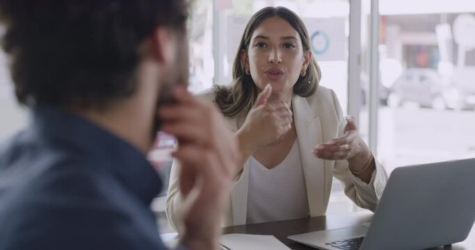 Young female entrepreneur discussing her plan for startup business with an investor. Manager having a meeting with partner or employee, talking about marketing strategies and projects to grow company