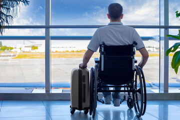 Young man in a wheelchair at the airport