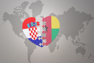 puzzle heart with the national flag of croatia and guinea bissau on a world map background.Concept.