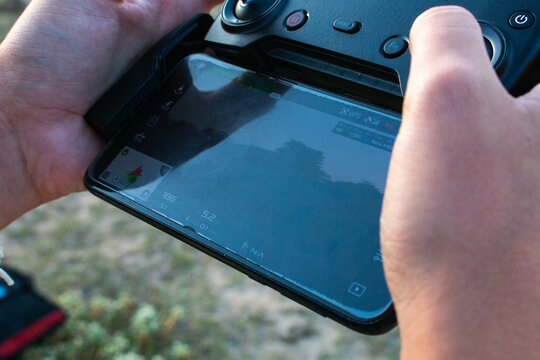 Manly Hands Using A Drone On The Beach