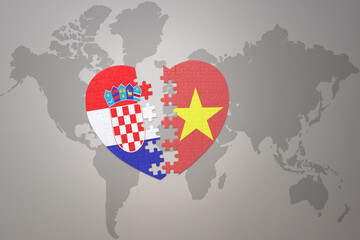 puzzle heart with the national flag of croatia and vietnam on a world map background.Concept.