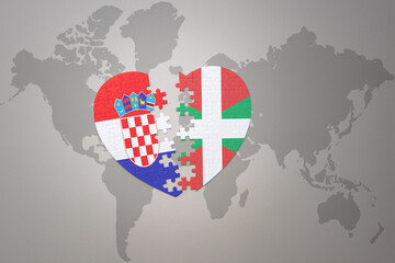 puzzle heart with the national flag of croatia and basque country on a world map background.Concept.