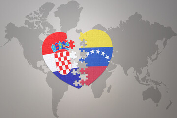 puzzle heart with the national flag of croatia and venezuela on a world map background.Concept.