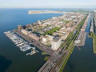 Obraz premium Amsterdam Ijburg artificial island modern residential area smart city cityscape at water Ijmeer. Urban houses buildings city environment area.