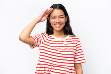 Young Colombian woman isolated on white background saluting with hand with happy expression