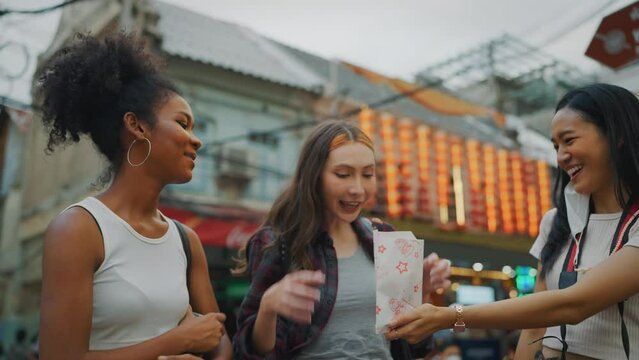 Group Of Beautiful Young Ladies Travel At City. They Eating Local Food Together.